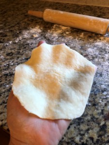 Steamed Bao Folding - place flattened dough in palm of hand