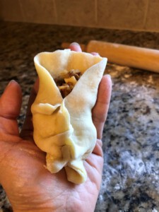 Steamed Bao Folding - fold in outer edges downwards in the middle